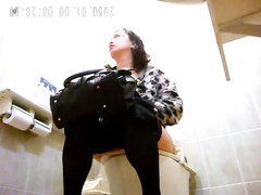 Asian lady enjoys sitting on the throne