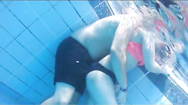 Attractive girl gets groped by her friend under the water