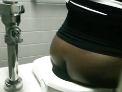 Spying on a black BBW pissing in a public toilet